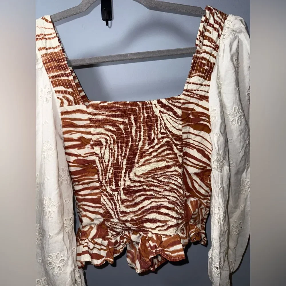 Anthropologie love the label Zebra Print Eyelet Puff sleeve smocked blouse S EUC